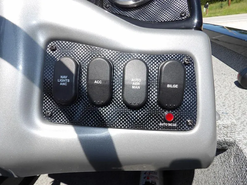 Slide: The Image of Control panel of 2020 G3 Sportsman 1810 boat with labeled switches. - 21