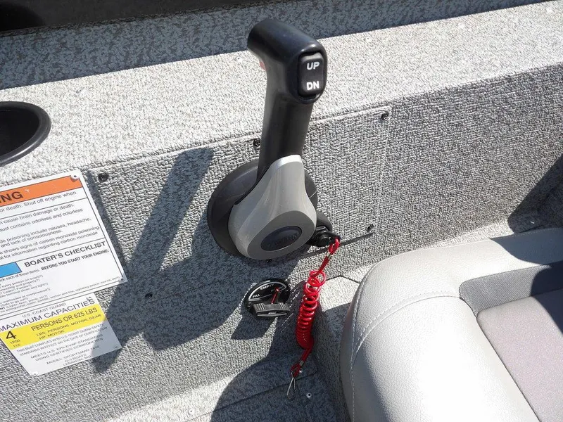 Slide: The Image of Throttle control of 2020 G3 Sportsman 1810 boat with safety lanyard and capacity warning. - 25