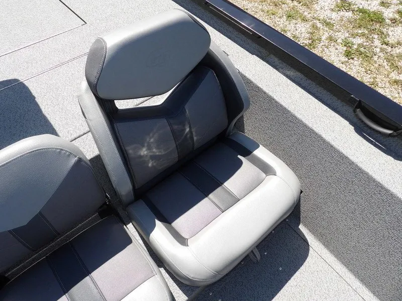 Slide: The Image of 2020 G3 Sportsman 1810 boat seats, gray and black upholstery, outdoor setting. - 29