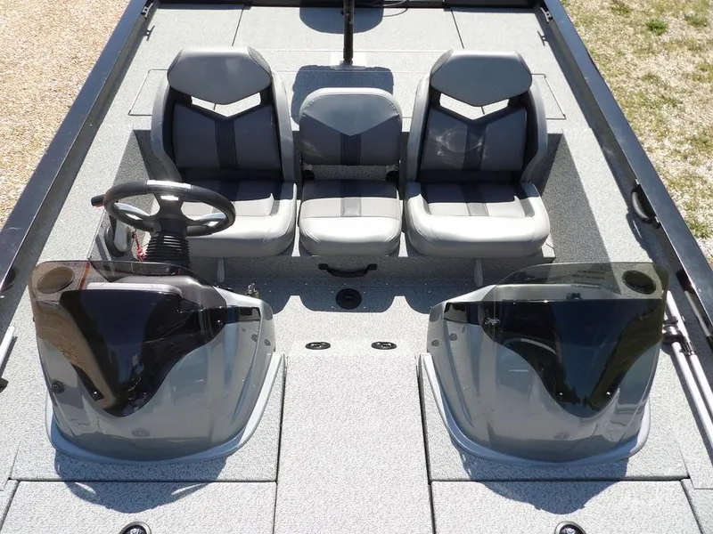 Slide: The Image of 2020 G3 Sportsman 1810 boat interior with three seats and dual consoles. - 32