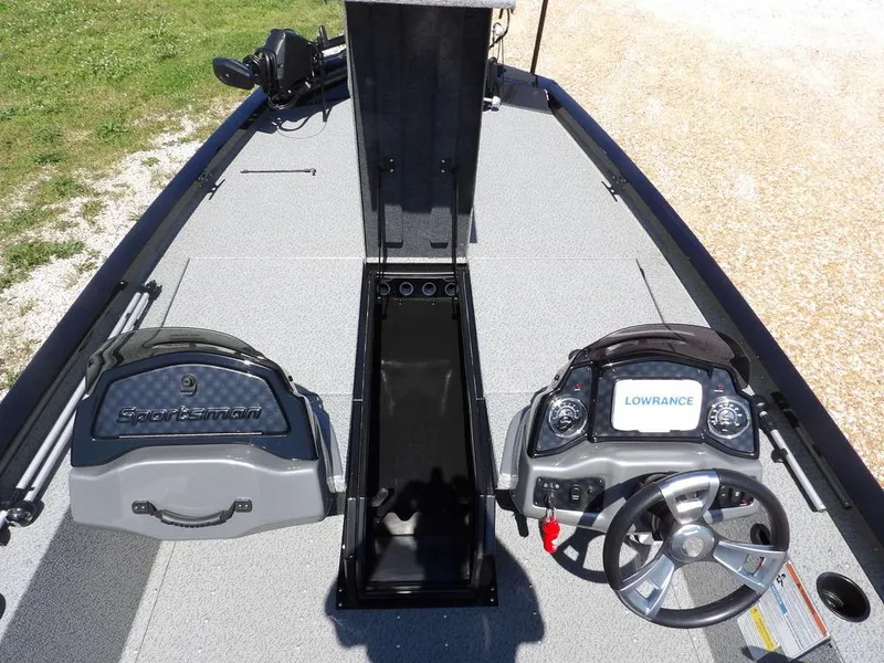 Slide: The Image of 2020 G3 Sportsman 1810 boat interior with steering console and storage compartments. - 35