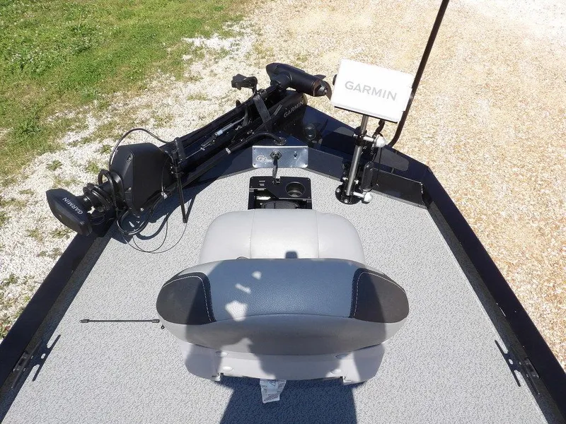 Slide: The Image of 2020 G3 Sportsman 1810 boat with Garmin equipment and seating, on a gravel and grass background. - 40