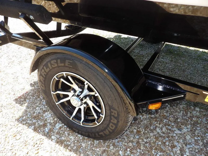 Slide: The Image of 2020 G3 Sportsman 1810 trailer wheel with Carlisle radial tire on gravel. - 48