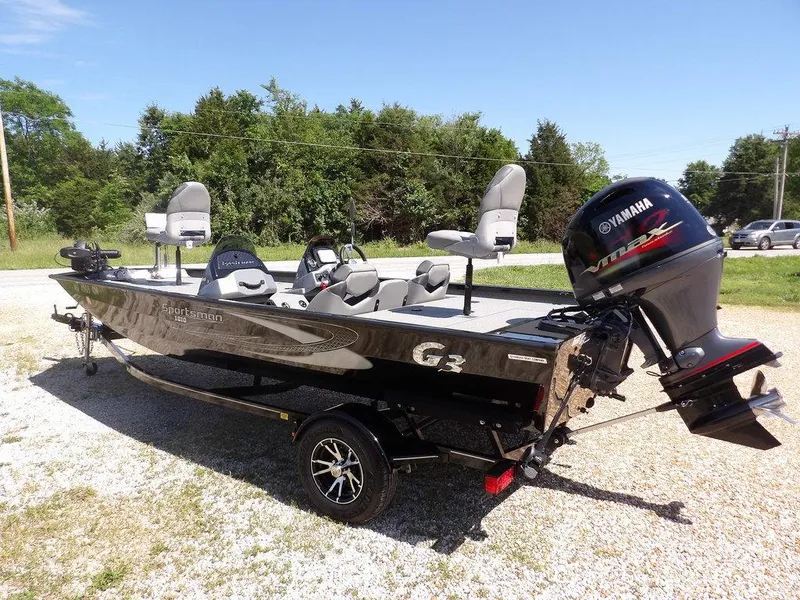 Slide: The Image of 2020 G3 Sportsman 1810 boat with Yamaha engine on trailer, parked outdoors. - 6