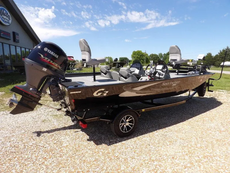 Slide: The Image of 2020 G3 Sportsman 1810 boat with Yamaha motor, parked outdoors on gravel. - 7