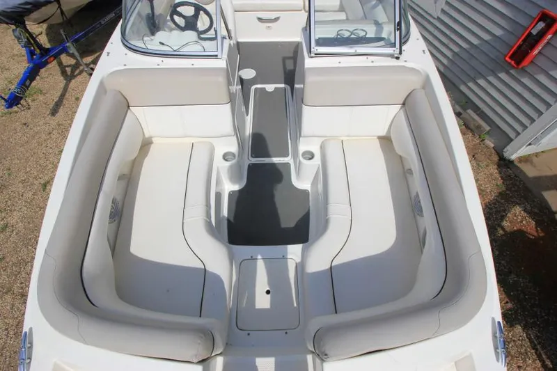 Slide: The Image of 2013 Bayliner 190 Deck Boat interior with spacious seating and modern design. - 24