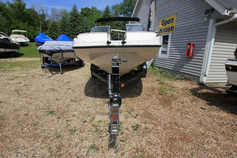 Slide: The Image of 2013 Bayliner 190 Deck Boat on trailer at open house event. - 3