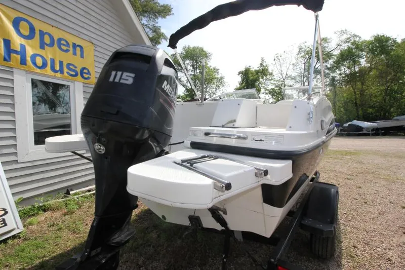Slide: The Image of 2013 Bayliner 190 Deck Boat with 115 Mercury engine at open house event. - 8