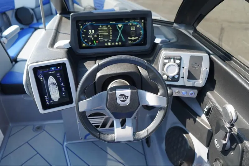 Slide: The Image of 2022 Malibu Wakesetter 25 LSV dashboard with advanced controls and digital displays. - 4