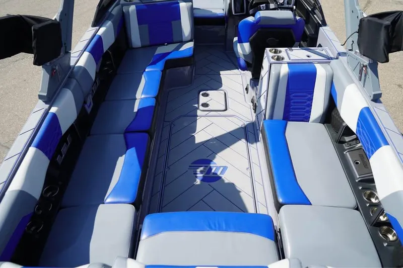 Slide: The Image of 2022 Malibu Wakesetter 25 LSV interior with blue and gray seating. - 5