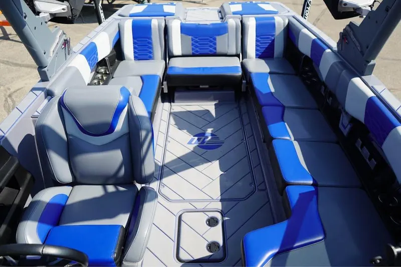 Slide: The Image of 2022 Malibu Wakesetter 25 LSV interior with blue and gray seating. - 6
