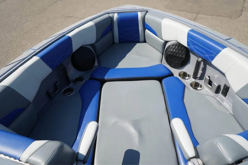 Slide: The Image of Interior of 2022 Malibu Wakesetter 25 LSV boat with blue and gray seating. - 7