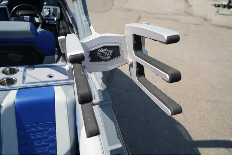 Slide: The Image of 2022 Malibu Wakesetter 25 LSV boat interior with wakeboard rack. - 8