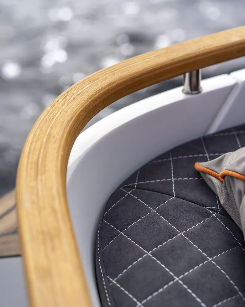 Slide: The Image of 2025 Marex 310 Sun Cruiser, elegant wood trim and quilted seating detail. - 27