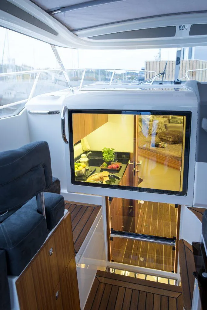 Slide: The Image of 2025 Marex 310 Sun Cruiser interior with modern kitchen and sleek design. - 36