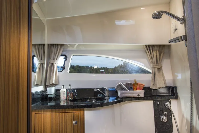 Slide: The Image of Modern bathroom interior of 2025 Marex 310 Sun Cruiser yacht with sleek design and window view. - 46