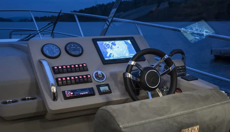 Slide: The Image of Helm of 2025 Marex 310 Sun Cruiser with modern navigation system at dusk. - 48