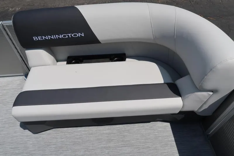 Slide: The Image of 2025 Bennington S L-Bench 20 SL boat seating, featuring sleek black and white upholstery. - 10