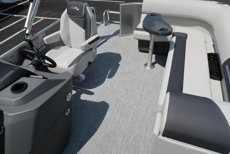 Slide: The Image of 2025 Bennington S L-Bench 20 SL boat interior with seating and steering console. - 5