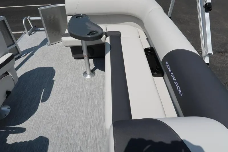 Slide: The Image of 2025 Bennington S L-Bench 20 SL boat interior with sleek seating and table. - 6