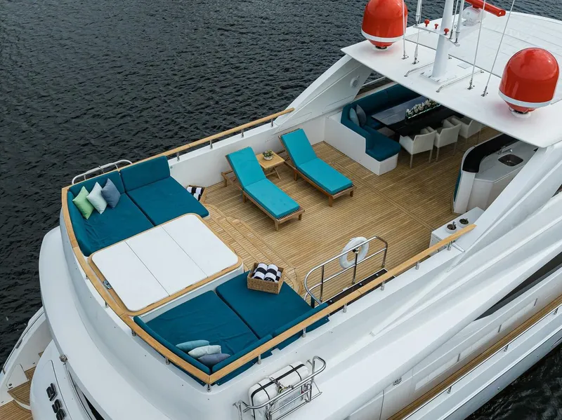 Slide: The Image of Luxurious 2009 Princess 95 yacht with spacious deck, sun loungers, and elegant seating area. - 18
