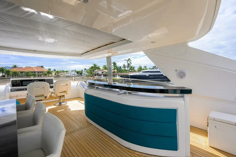 Slide: The Image of Luxurious 2009 Princess 95 yacht deck with bar and seating, featuring elegant design and ocean views. - 22
