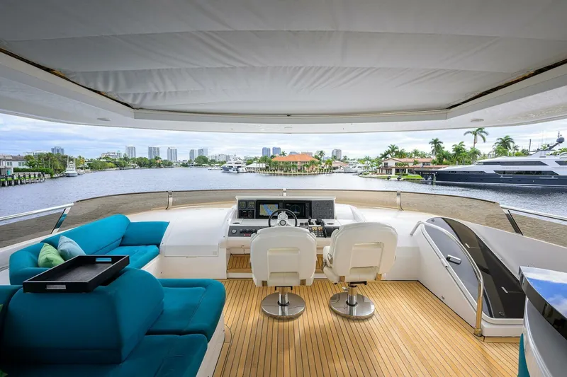 Slide: The Image of Luxurious 2009 Princess 95 yacht interior with modern helm and plush seating. - 23