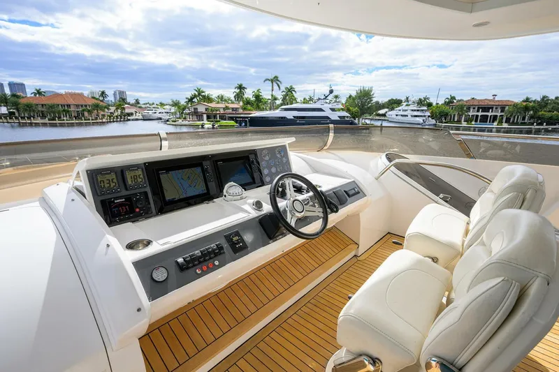 Slide: The Image of Luxurious 2009 Princess 95 yacht helm with modern navigation systems and plush seating. - 24