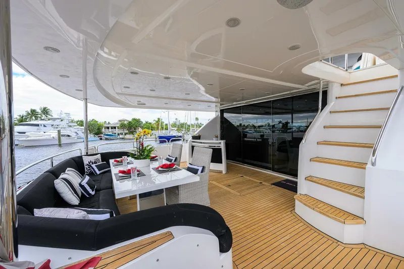 Slide: The Image of Luxurious 2009 Princess 95 yacht deck with elegant dining area and staircase. - 26