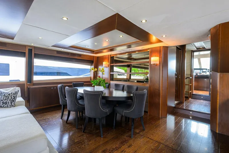 Slide: The Image of Luxurious interior of 2009 Princess 95 yacht with elegant dining area and wooden finishes. - 29