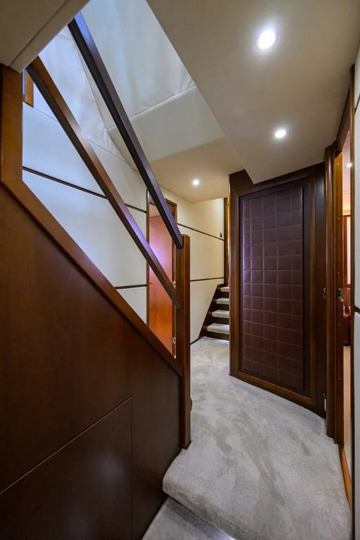 Slide: The Image of Luxurious interior hallway of 2009 Princess 95 yacht with elegant wood finishes. - 35