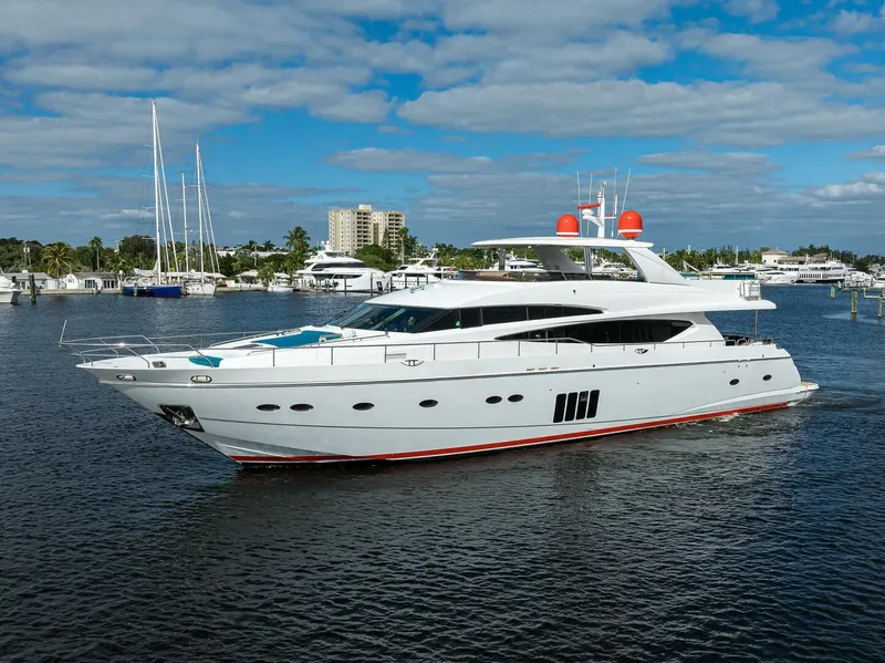 Slide: The Image of Luxury 2009 Princess 95 yacht cruising on a sunny day with marina backdrop. - 4