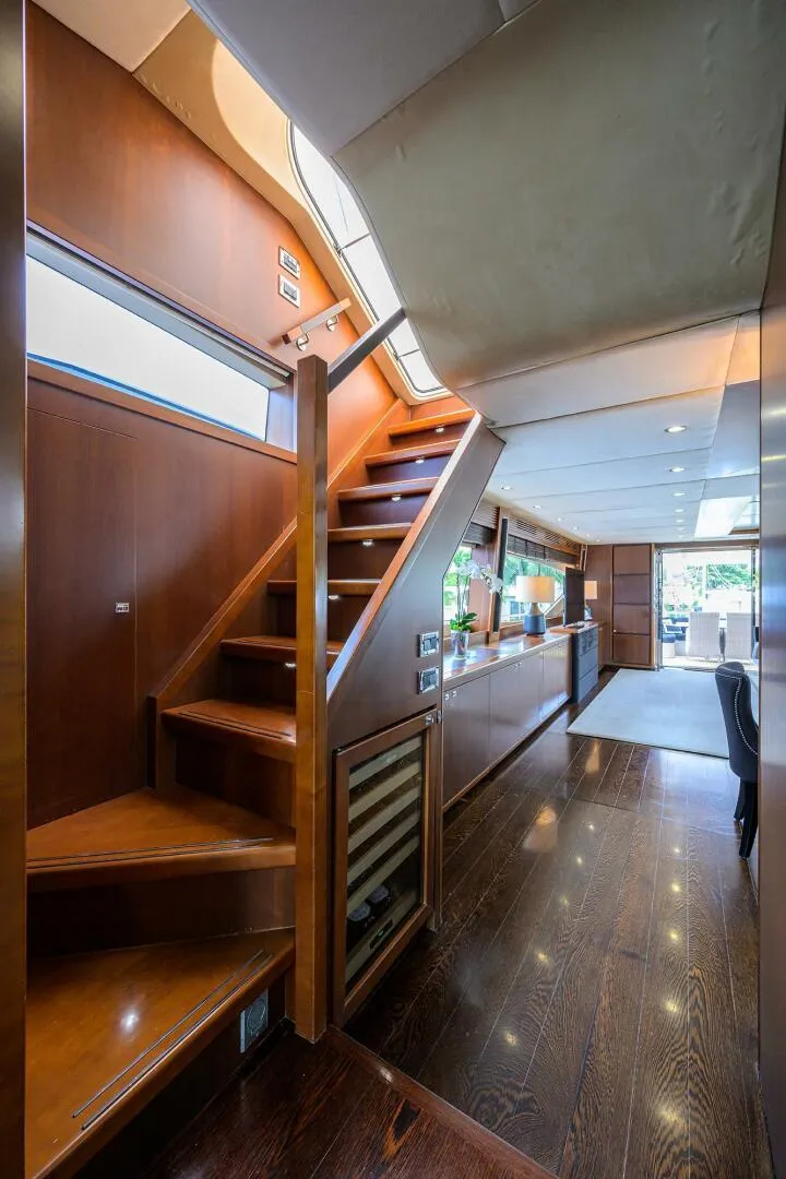 Slide: The Image of Interior of 2009 Princess 95 yacht with wooden staircase and modern design. - 41