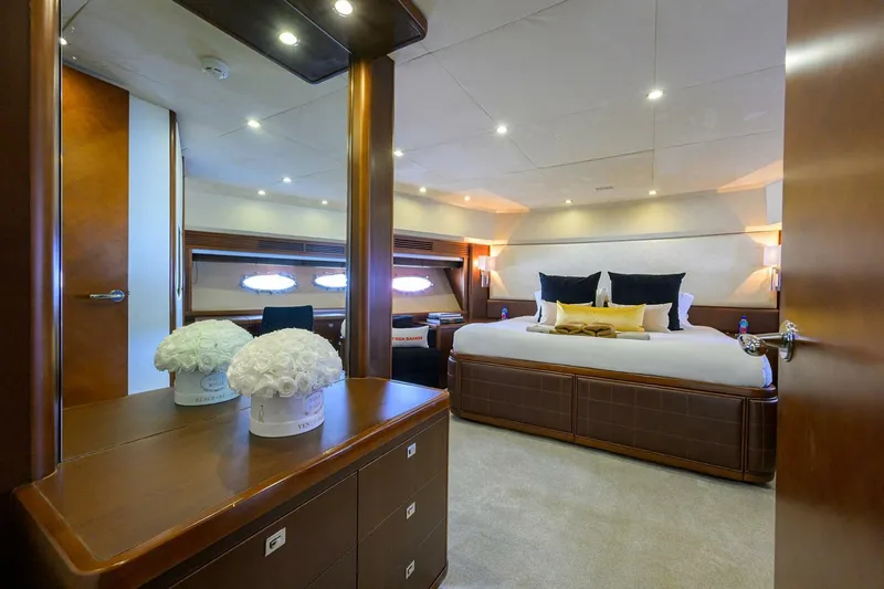 Slide: The Image of Luxurious bedroom interior on 2009 Princess 95 yacht with elegant decor and ambient lighting. - 42