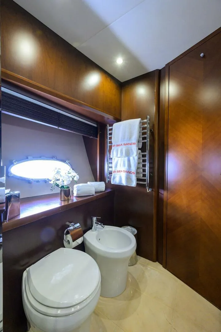 Slide: The Image of Luxurious bathroom in 2009 Princess 95 yacht with elegant wood paneling and modern fixtures. - 49