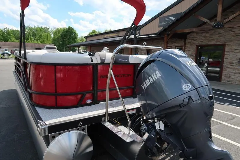Slide: The Image of 2025 Bennington S Quad Bench 22 SSR pontoon boat with Yamaha outboard motor. - 13