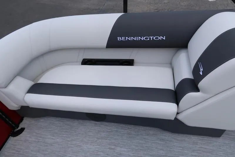 Slide: The Image of 2025 Bennington S Quad Bench 22 SSR boat seating, featuring sleek white and gray upholstery. - 21