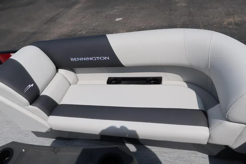 Slide: The Image of 2025 Bennington S Quad Bench 22 SSR, luxurious gray and white seating with cup holders. - 9