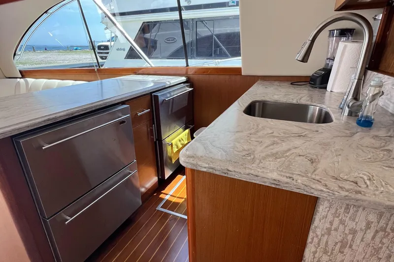 Slide: The Image of Luxurious kitchen interior of 1998 Ocean Yachts 45 Super Sport with modern appliances. - 4
