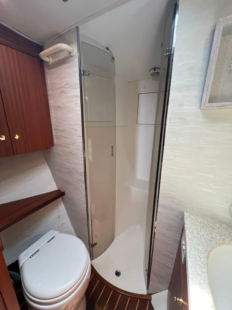 Slide: The Image of Bathroom interior of 1998 Ocean Yachts 45 Super Sport with shower and toilet. - 7