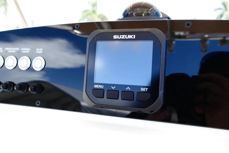 Slide: The Image of Control panel of 2026 Pioneer 222 Islander boat with Suzuki display and buttons. - 15