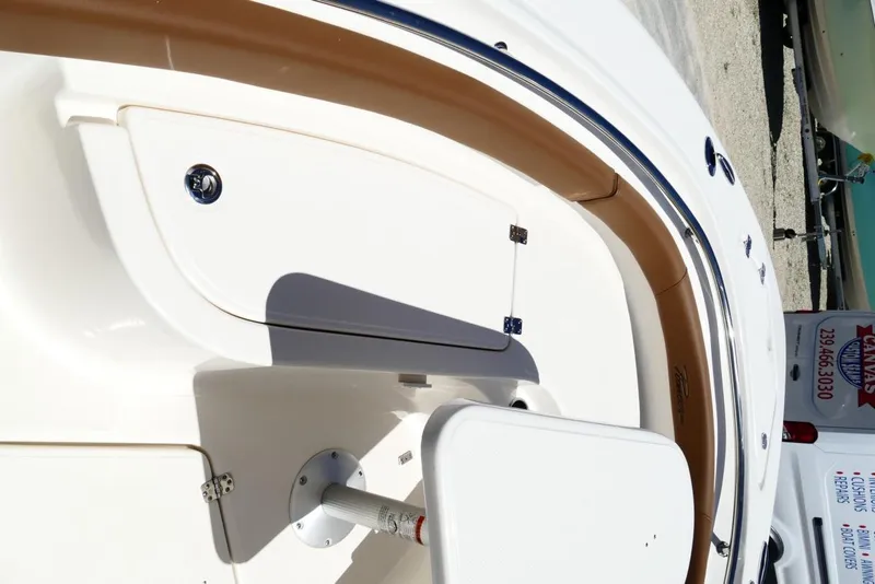 Slide: The Image of 2026 Pioneer 222 Islander boat interior with seating and storage compartments. - 23