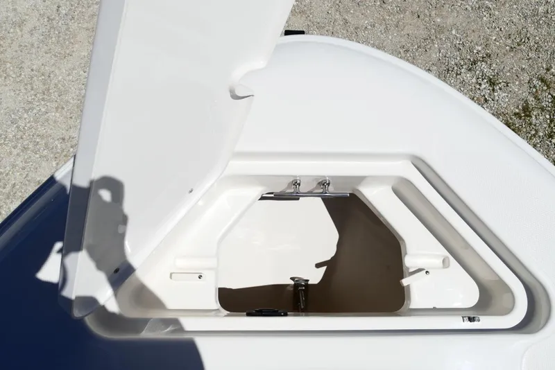 Slide: The Image of Open storage compartment on 2026 Pioneer 222 Islander boat, showcasing interior space. - 27