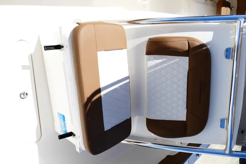 Slide: The Image of 2026 Pioneer 222 Islander boat seat with brown and white cushioned design. - 31