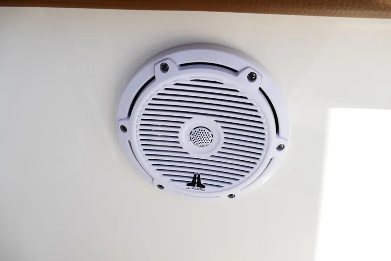 Slide: The Image of White JL Audio speaker on 2026 Pioneer 222 Islander boat interior. - 32