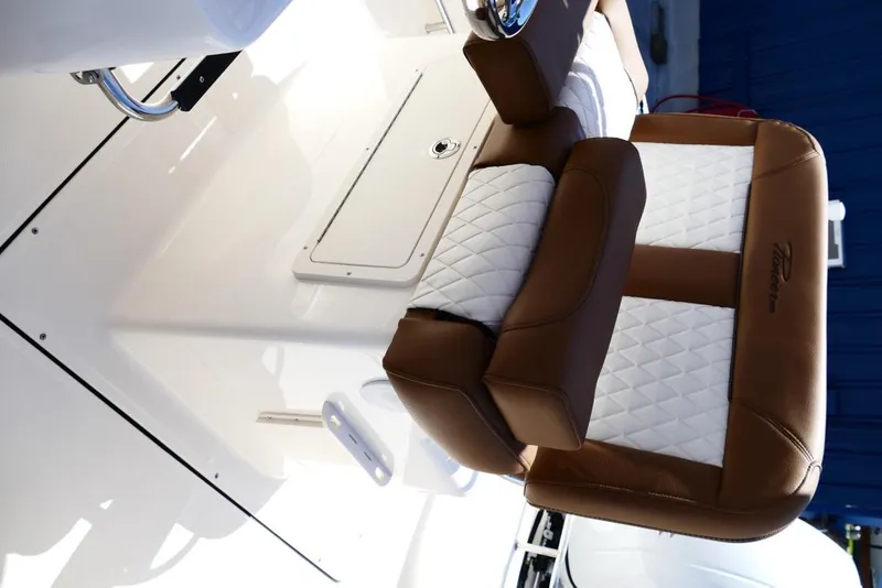 Slide: The Image of Luxurious seating on 2026 Pioneer 222 Islander boat with brown and white upholstery. - 35