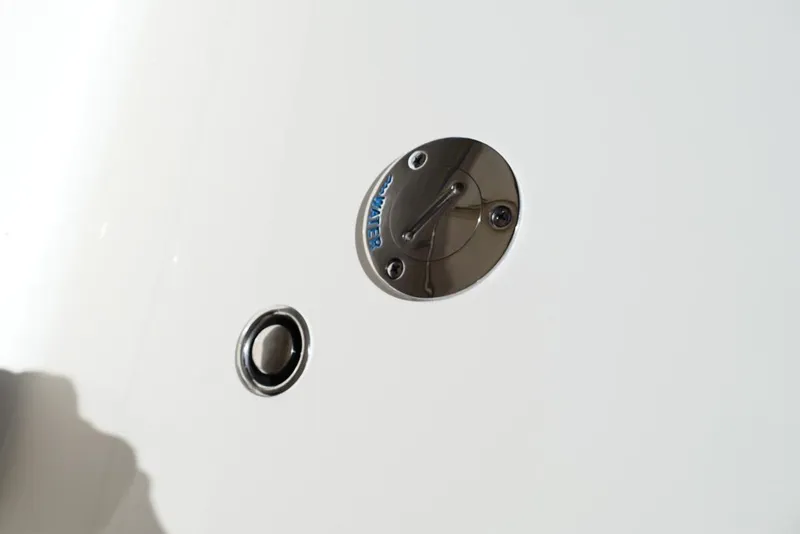 Slide: The Image of Close-up of 2026 Pioneer 222 Islander boat water inlet and drain. - 44
