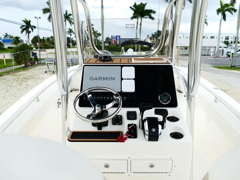 Slide: The Image of 2026 Bulls Bay 255CC boat dashboard with Garmin navigation system and steering wheel. - 11