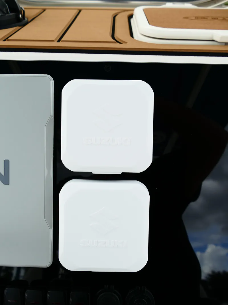 Slide: The Image of 2026 Bulls Bay 255CC boat dashboard with Suzuki components and sleek design. - 16