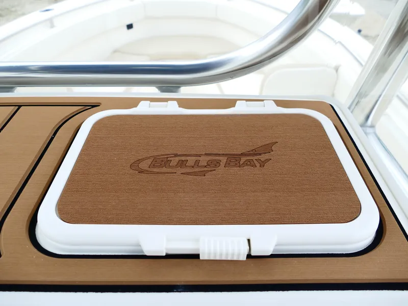 Slide: The Image of 2026 Bulls Bay 255CC boat deck with logo-engraved hatch cover. - 20